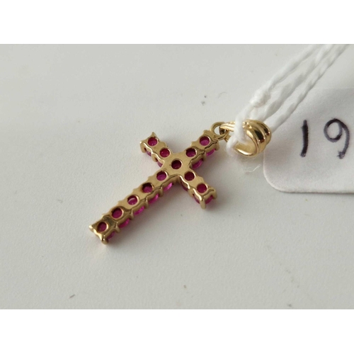 661 - A ruby set cross pendant, 9ct