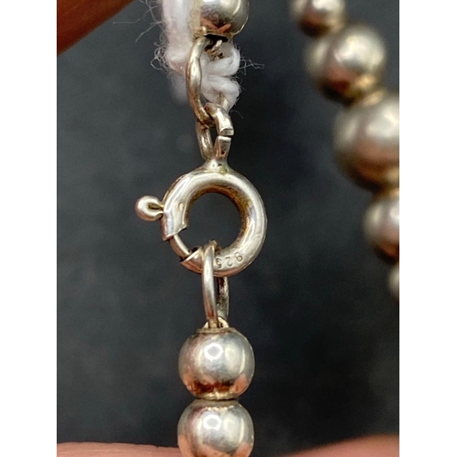 701 - A silver bead bracelet