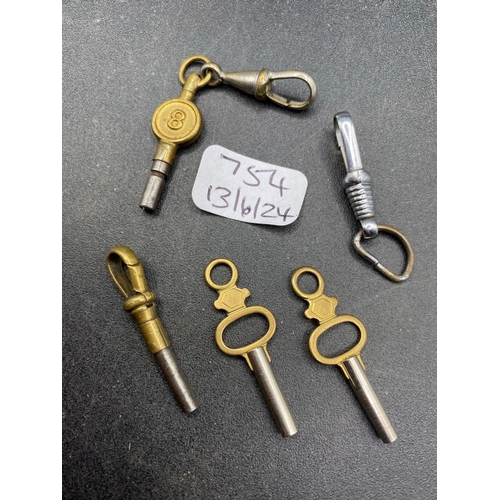 754 - A bag of four watch keys and two steel watch clips