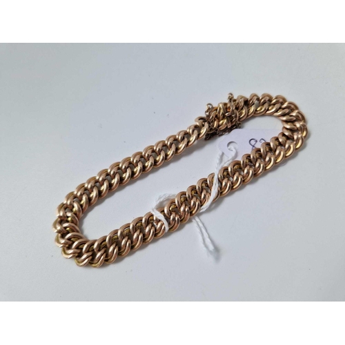 82 - A FLAT CURB LINK BRACELET WITH CONCEALED CLASP, 9ct, 7 inch, 14.9 g