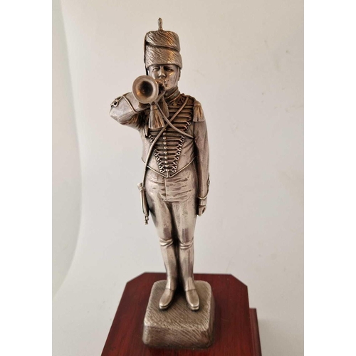 843 - A Silver Coloured Model of Trumpeter on Wooden base 12.5�