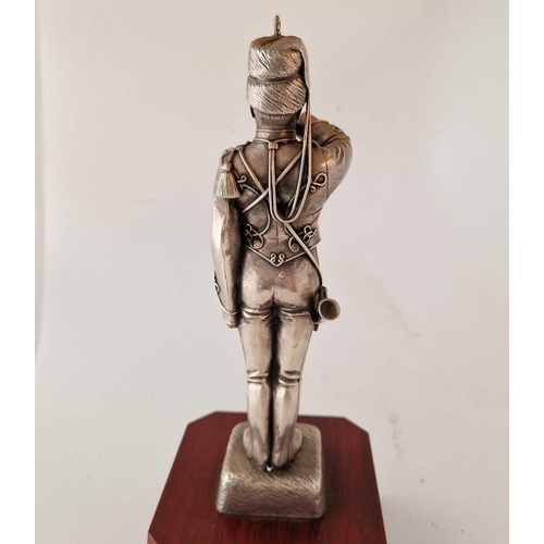 843 - A Silver Coloured Model of Trumpeter on Wooden base 12.5�