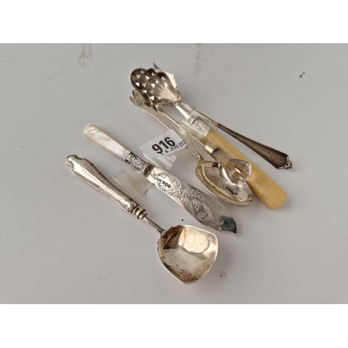 916 - A silver mounted bread fork, Sheffield 1905, a butter knife etc