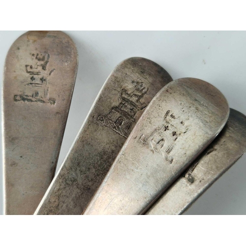 924 - A set of four George III bottom marked table spoons, crested terminals, London 1777 by script TL?, 2... 