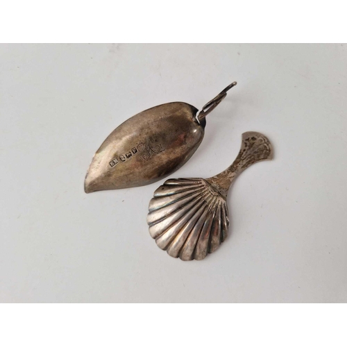 928 - A leaf shaped caddy spoon Georgian, A/F, 1801 and another with shell bowl, Birmingham 1816