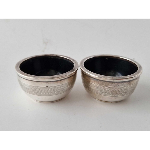 935 - A pair of circular salts with lined interior, 2 inches diameter, Birmingham 1935