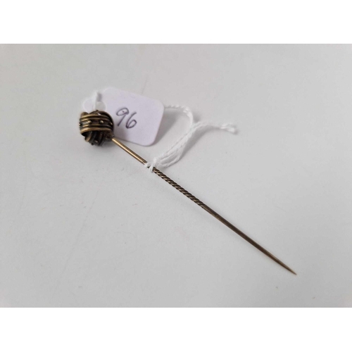 96 - A gold topped knot stick pin