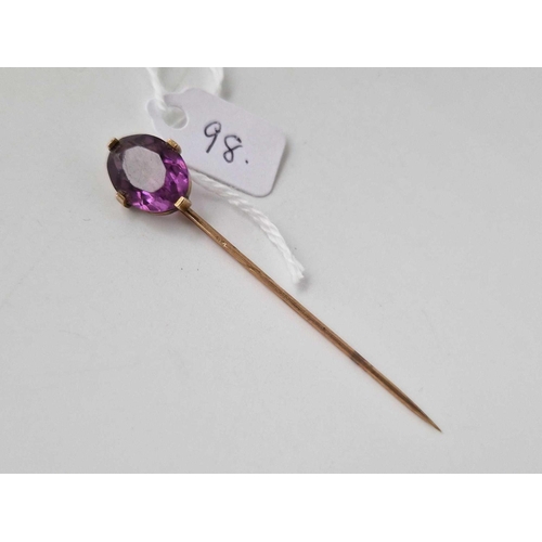 98 - A gold and amethyst stick pin