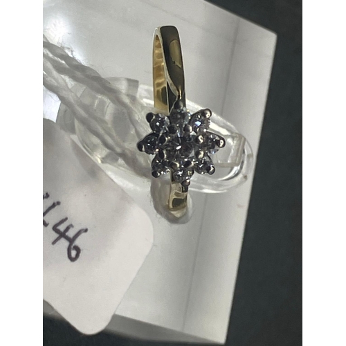 446 - A pretty diamond daisy cluster ring 18ct gold size J 2 g