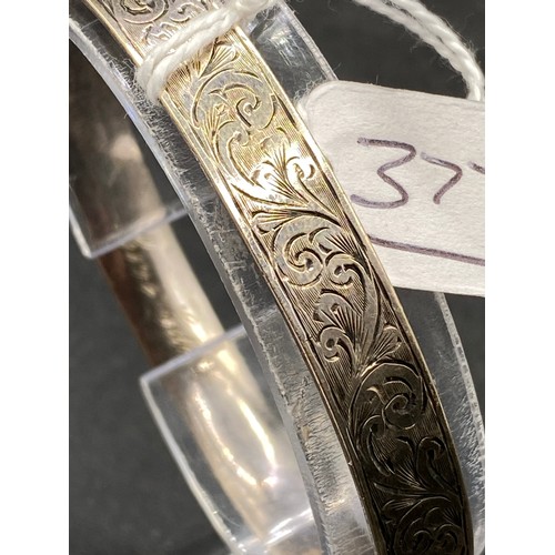 377 - A 9ct white gold bangle with metal core 22 g