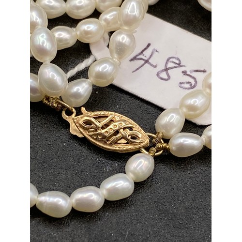 485 - A triple row of pearls with 9ct clasp, 15 inch