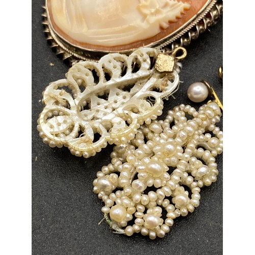 489 - A pair of antique pearl earrings and a cameo brooch