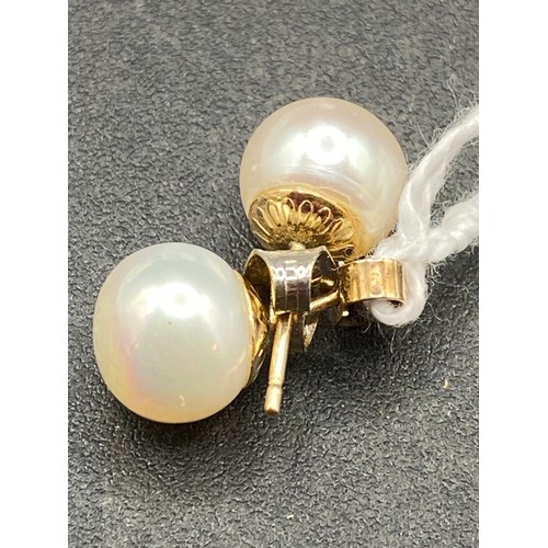 396 - A pair of pearl ear studs, 9ct