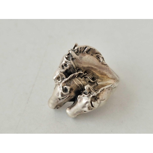 110 - A silver horse ring size L and matching earrings 13 gms