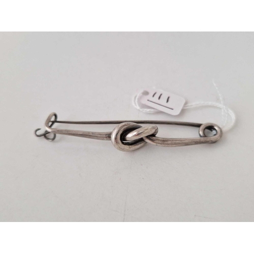 111 - A large silver knot brooch length 75mm