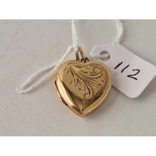 112 - A hinged heart locket with scroll decoration 9ct 3.9 gms