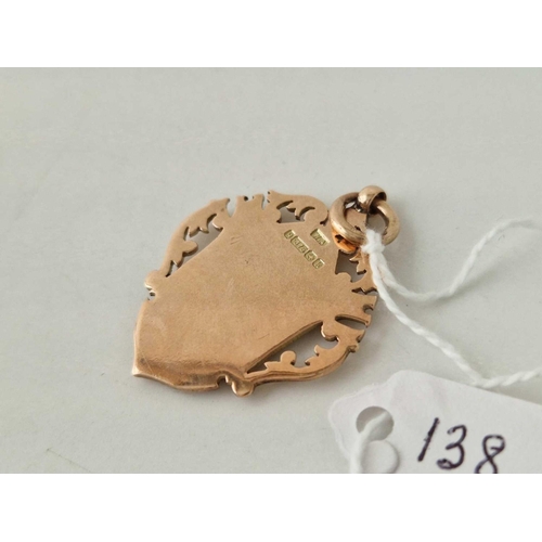 138 - A EDWARDIAN SHIELD SHAPED FOB MEDALLION 9CT 8.7 GMS