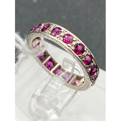 143 - A 1920s ENGRAVED PLATINUM FULL RUBY ETERNITY RING SIZE L 4.1 GMS