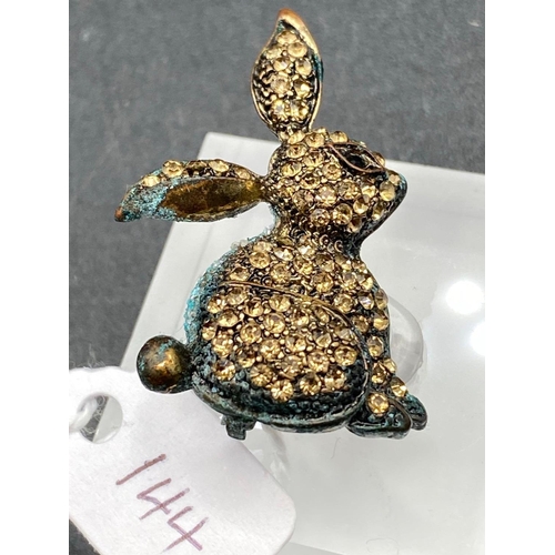 144 - A antique gem set rabbit brooch with garnet eye