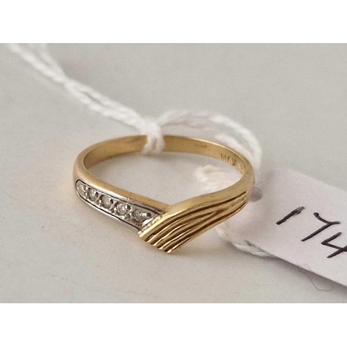 174 - A diamond twist ring 14ct gold size O 2.2 gms