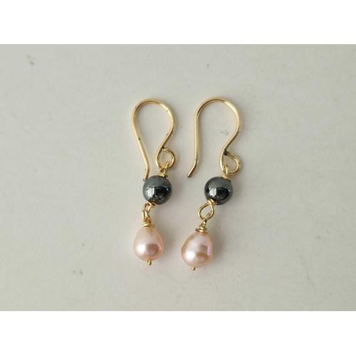 181 - A pair of two pearl drop earrings 9ct