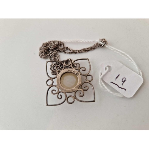 19 - A silver pendant on silver chain set with a centre chalcedony