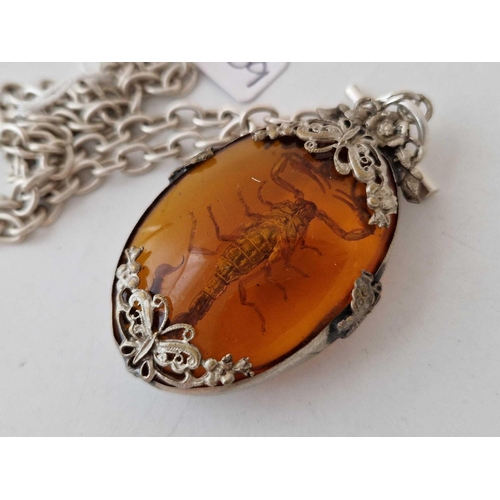 209 - A large silver and amber style pendant on silver chain 16 inch