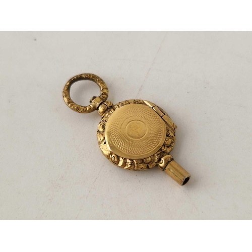 35 - A unusual antique back and front watch key with locket