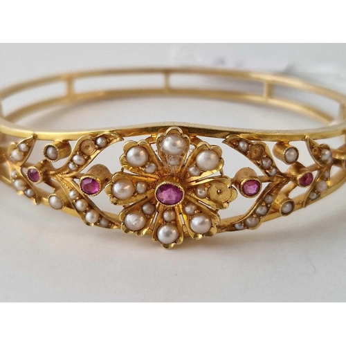 37 - A RUBY AND PEARL BANGLE SOME PEARLS MISSING 18CT GOLD 14.9 GMS