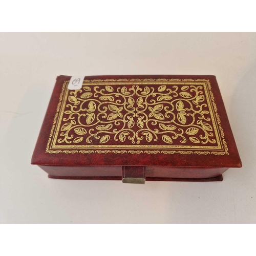 69 - A red leatherette bound box of old costume jewellery