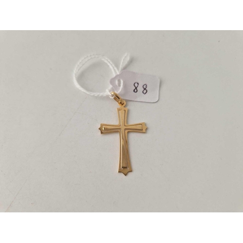 88 - A 18ct gold cross 1.4 gms