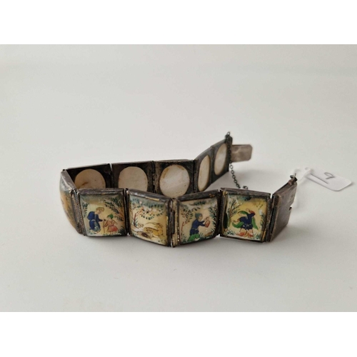 9 - A silver and MOP ten panel bracelet with oriental scenes 7 inch