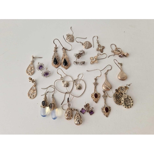 94 - Fourteen pairs of silver earrings 48 gms