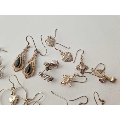 94 - Fourteen pairs of silver earrings 48 gms