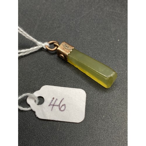 46 - A gold mounted hard stone pendant 3.5 gms