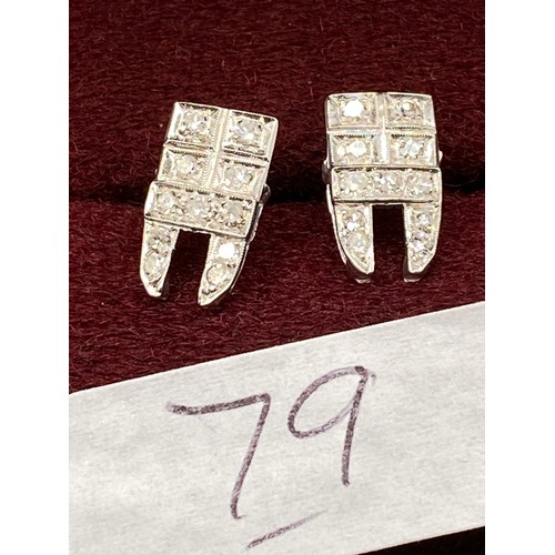 79 - A pair of platinum and diamond stud earrings