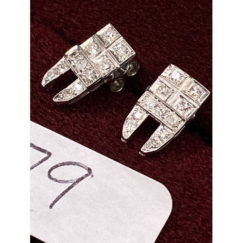 79 - A pair of platinum and diamond stud earrings