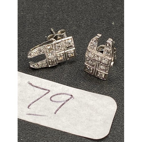 79 - A pair of platinum and diamond stud earrings