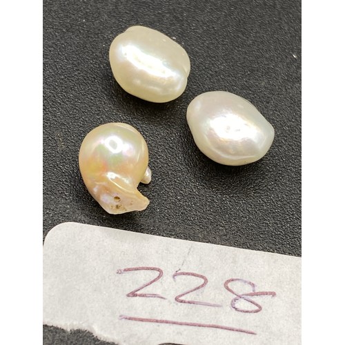 228 - Three natural pearls