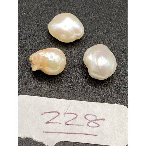 228 - Three natural pearls