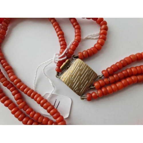 11 - A three strand coral necklace, 8.5 inches