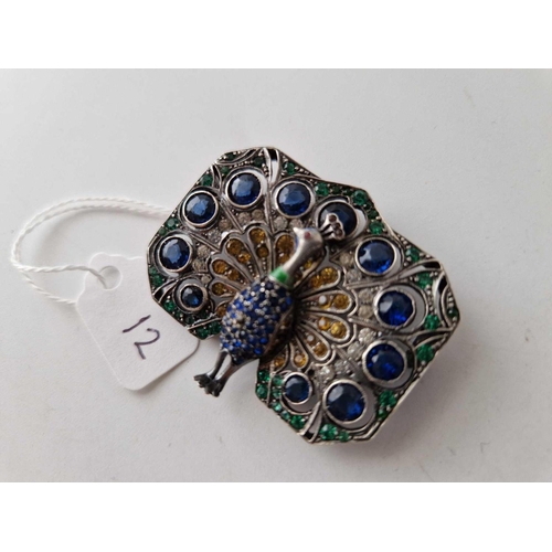 12 - A silver and paste peacock brooch