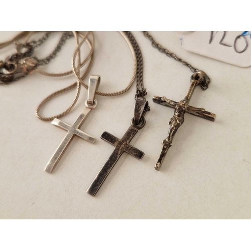 120 - Three silver crucifix pendant necklaces