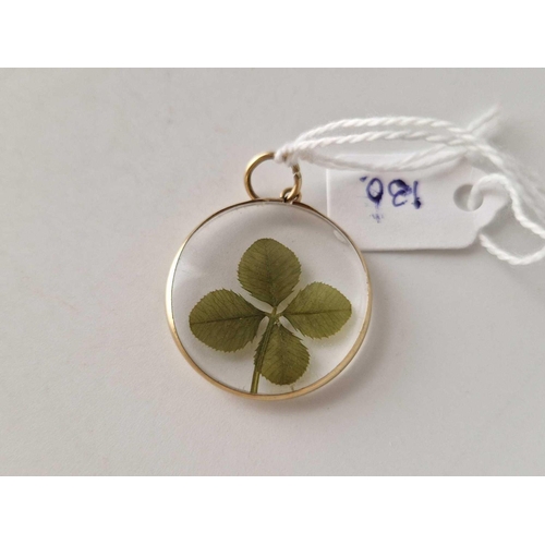 130 - A mounted locket with four leaf clover 9ct