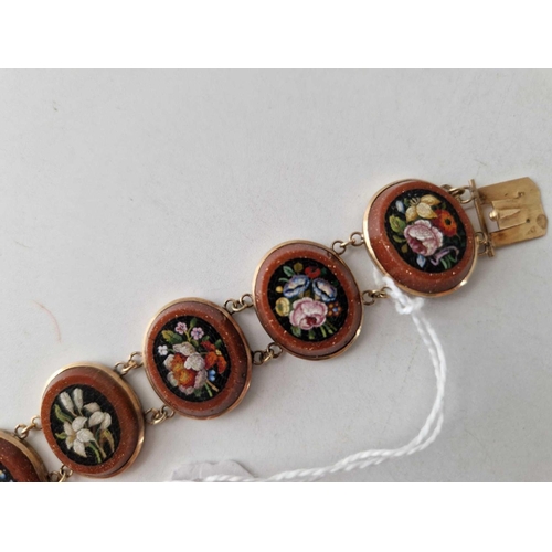 133 - A ANTIQUE VICTORIAN GOLD MOUNTED MICRO MOSAIC BRACELET EACH PANEL WITH A DIFFERENT FLORAL DESIGN 15C... 