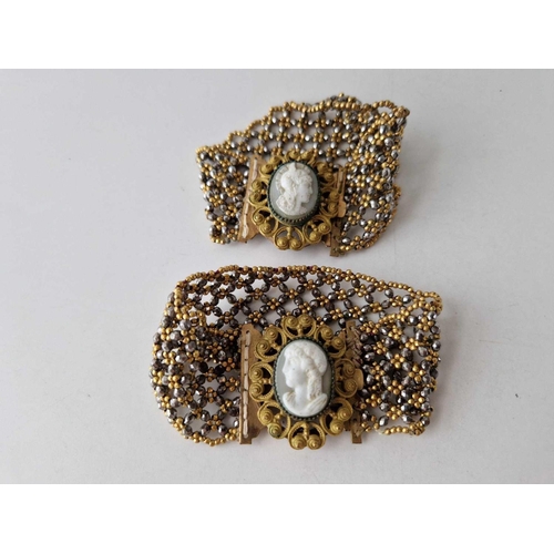 135 - A PAIR OF VICTORIAN WOVEN BEADED BRACELETS WITH GOLD COLOURED AND CUT STEEL BEADS SET WITH A CAMEO T... 