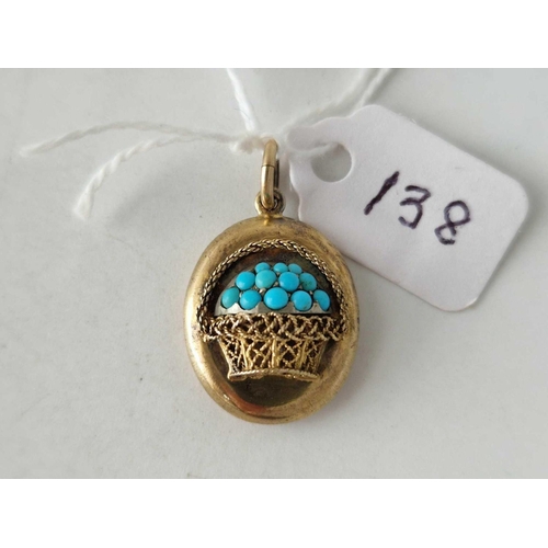 138 - A VICTORIAN GOLD PENDANT SET WITH TURQUOISE DESIGNED AS A BASKET OF FLOWERS