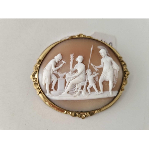 140 - A Victorian oval cameo brooch depicting a classical scene with a ROMAN worrier and cherub 65 X 58 mm