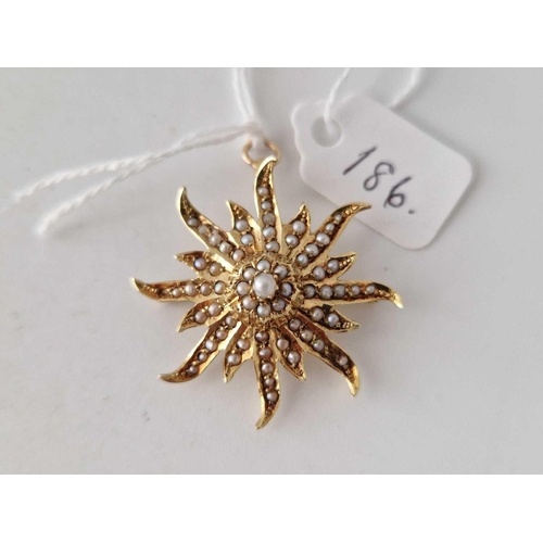 186 - A gold and pearl star brooch pendant 5.8 gms