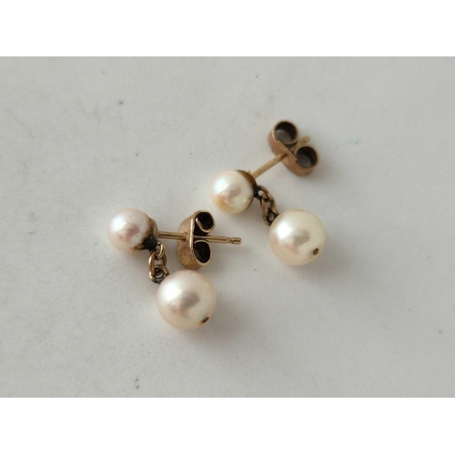 187 - A pair of pearl drop earrings 9ct